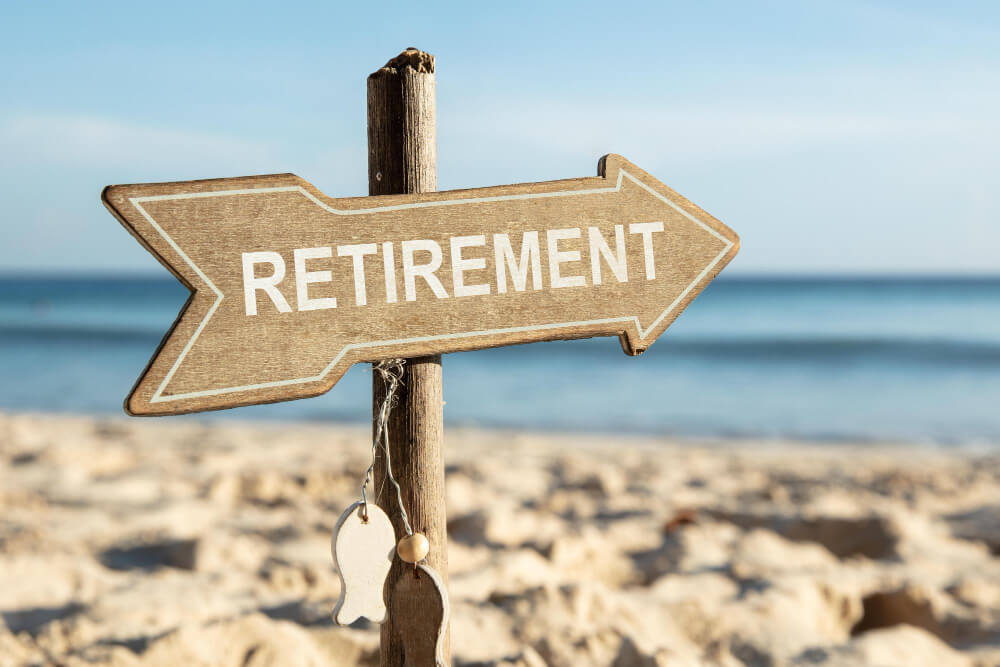 Sign pointing to retirement indicating milestones.