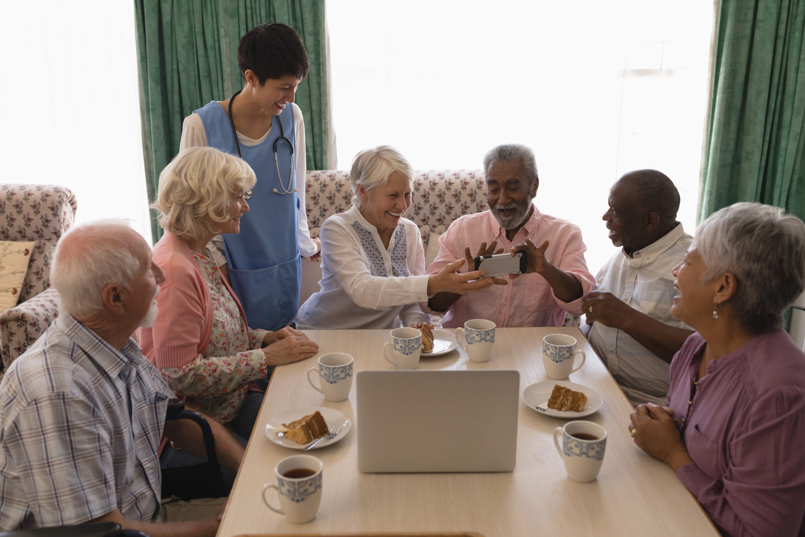 group of seniors sitting around a table.