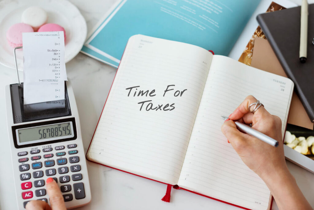 retiree calculating their tax bill based on their tax-deferred retirement accounts