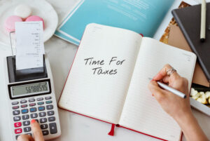 retiree calculating their tax bill based on their tax-deferred retirement accounts