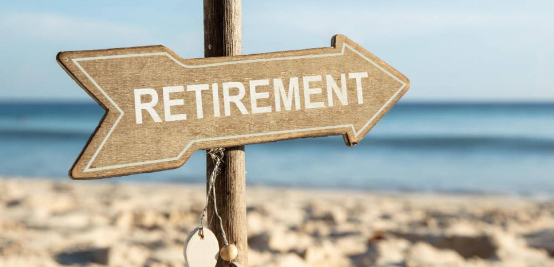 Sign pointing to retirement indicating milestones.