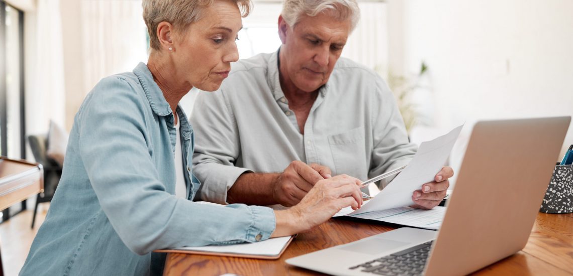 Communication, discussion and couple with paperwork planning financial strategy budget plan. Senior man and woman with documents review finance expenses, retirement plan or mortgage banking payment.