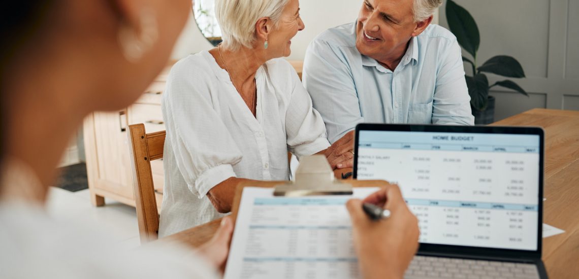 Senior couple, laptop and financial advisor in retirement finance planning paper, budget loan or investment insurance documents. Smile, happy or excited man and woman consulting funeral policy worker.