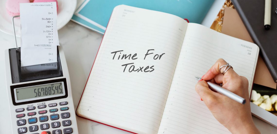 retiree calculating their tax bill based on their tax-deferred retirement accounts